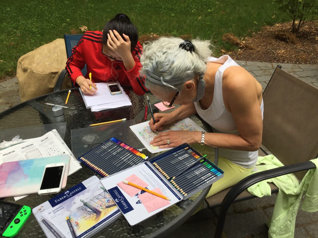 Pandemic response on the patio: coloring, drawing, gaming.